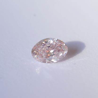 0,56 ct, Fancy Light Orangy Pink, SI1, Oval, GIA Certified